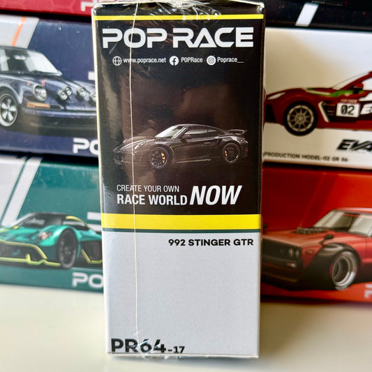 Side profile showing widebody styling on 992 Stinger GTR Carbon diecast car