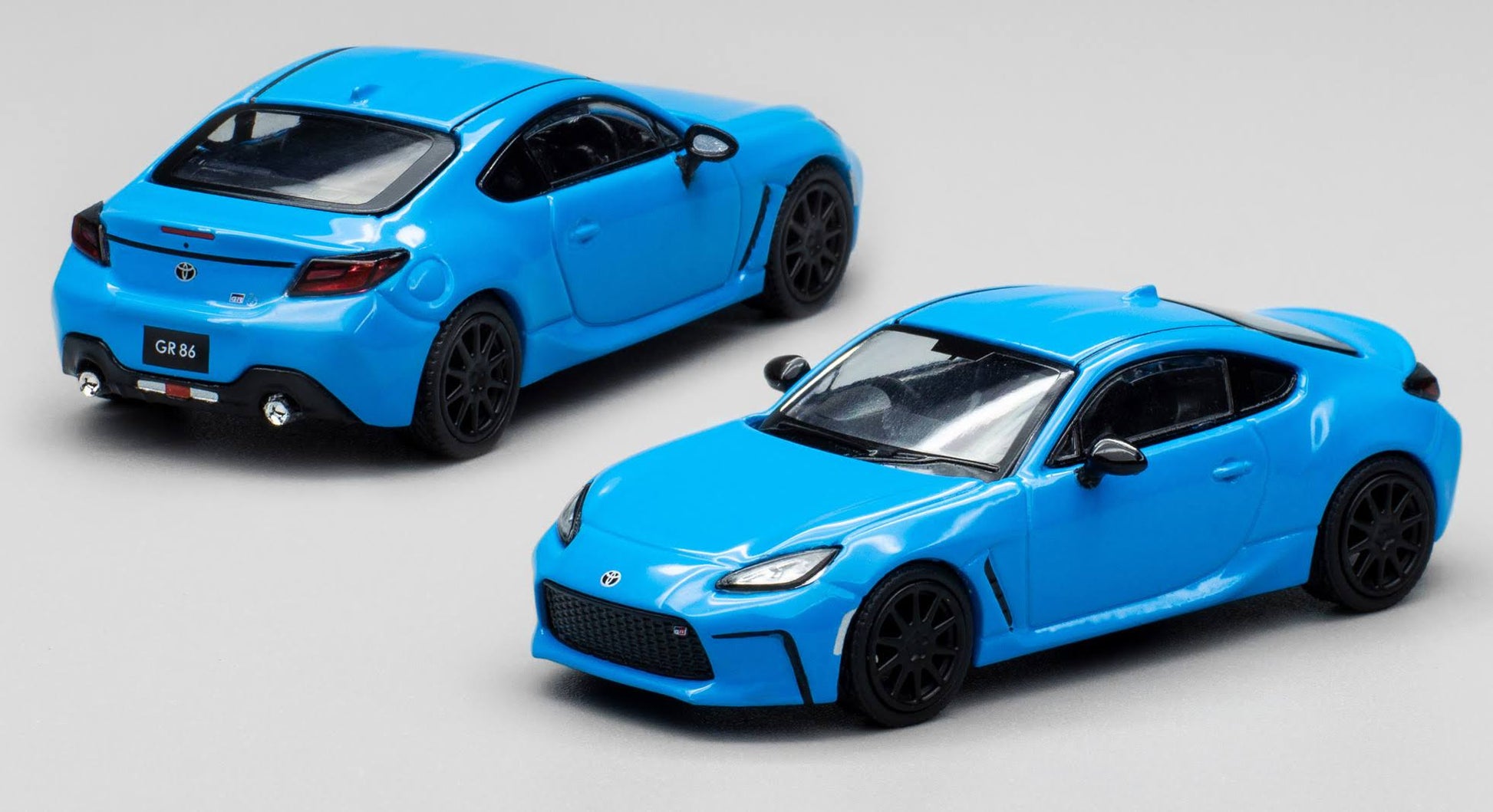 Side profile of unboxed Toyota GR86 Neptune Blue diecast by Pop Race