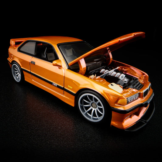 Side profile of Hot Wheels Collectors 1:64 BMW M3 LTW in orange