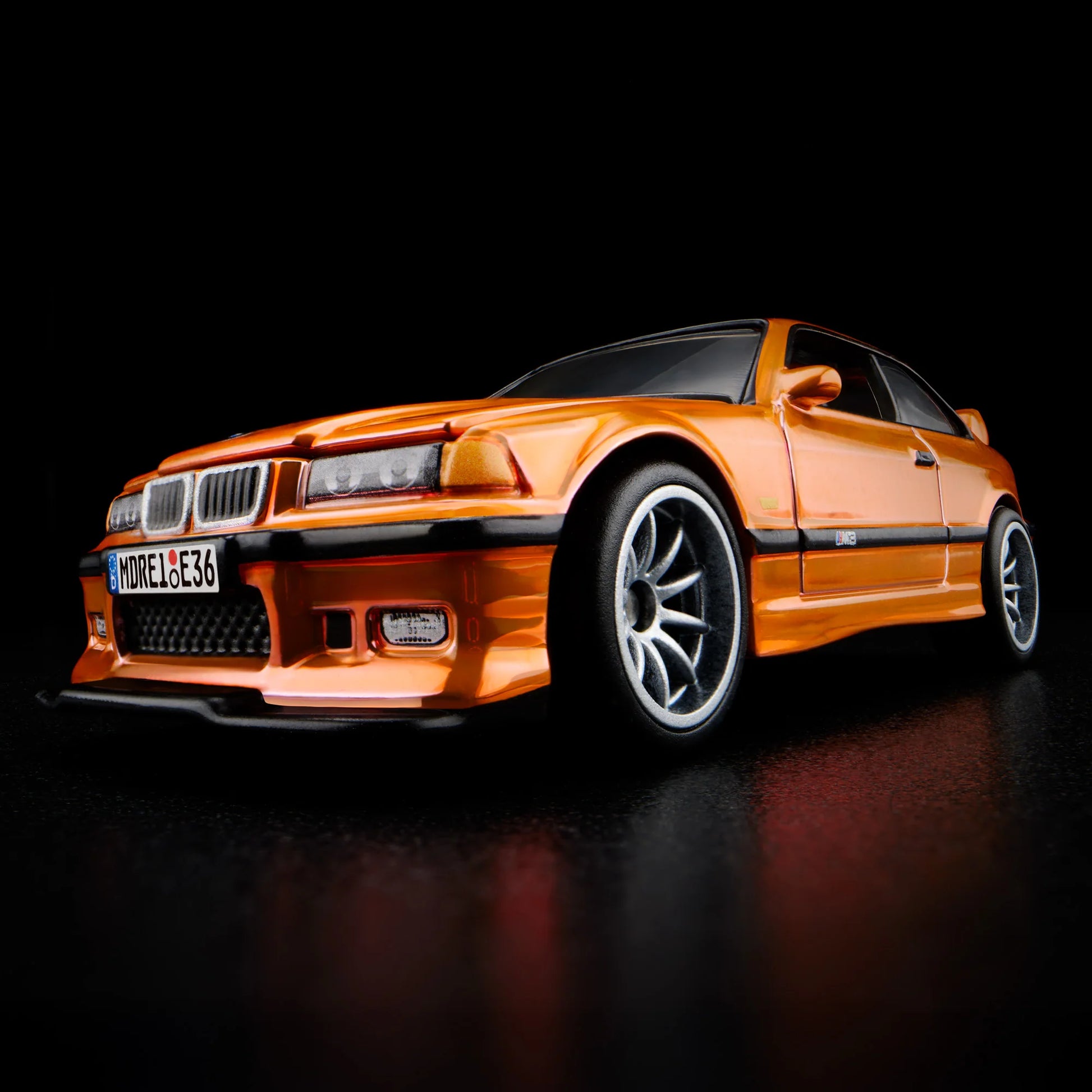 Side profile of Hot Wheels Collectors 1:64 BMW M3 LTW in orange