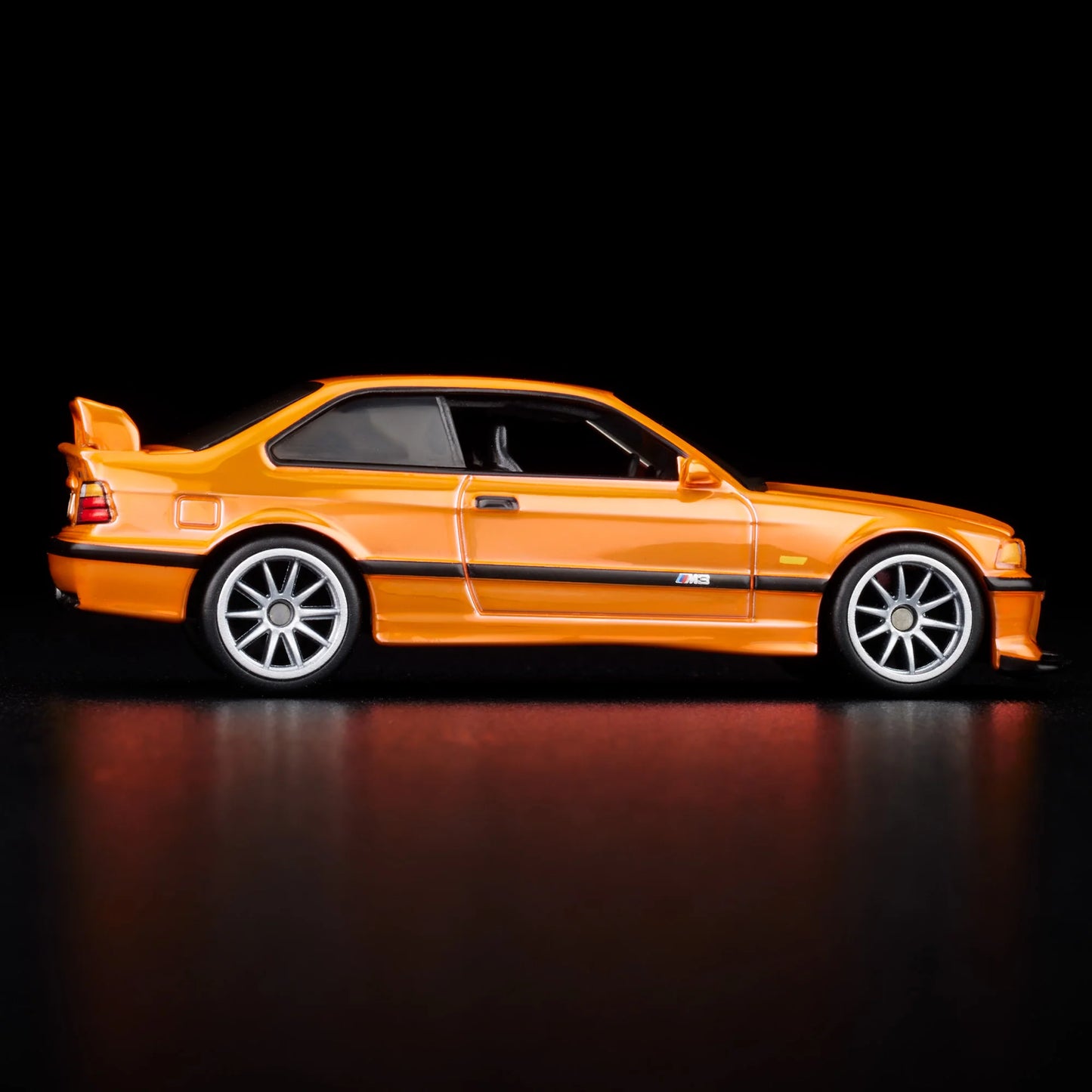 Side profile of Hot Wheels Collectors 1:64 BMW M3 LTW in orange