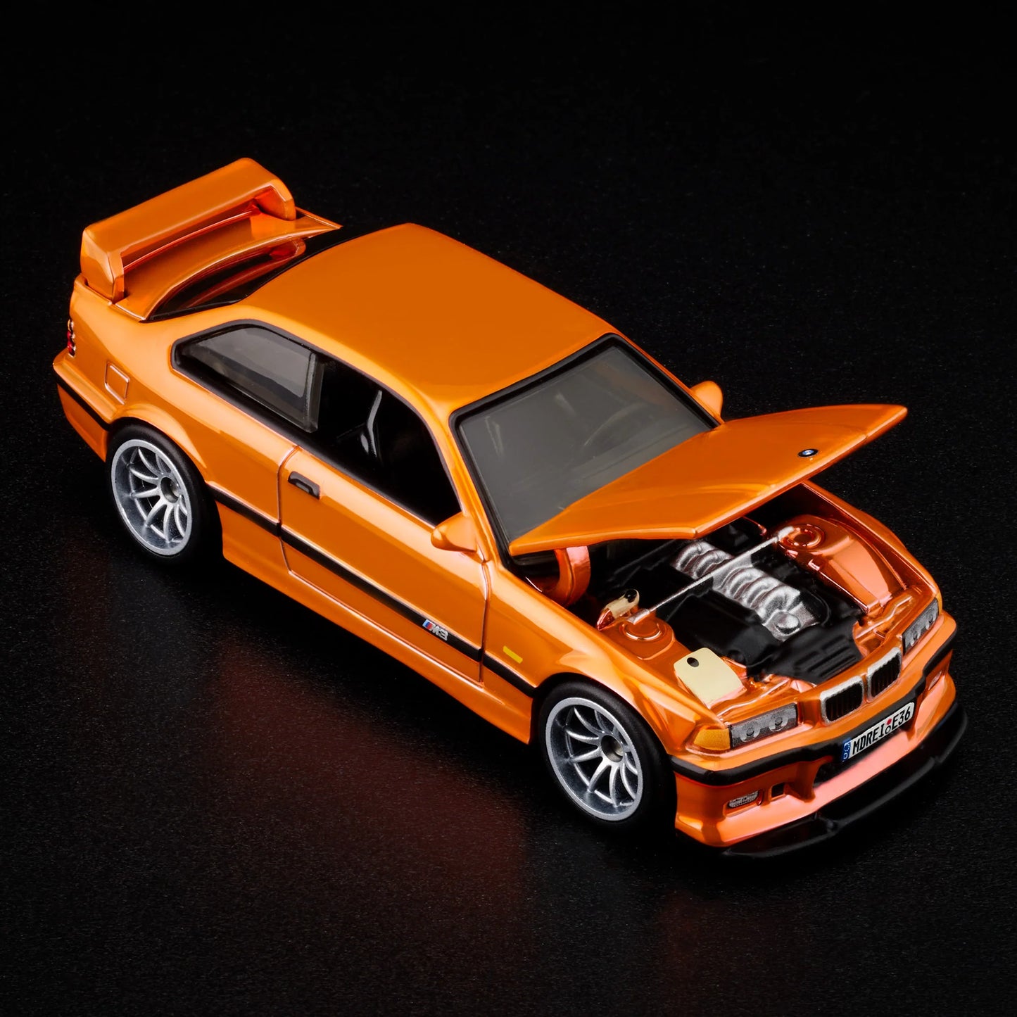 Top-down view of bright orange BMW M3 LTW 1995 Hot Wheels model