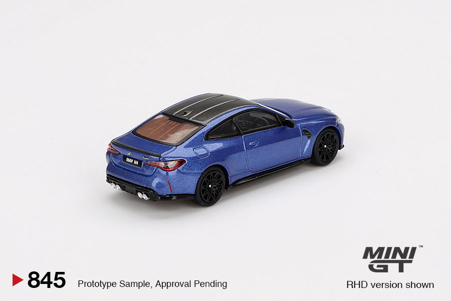 Rear view of 1:64 BMW M4 Competition Portimao Blue model car by Mini GT