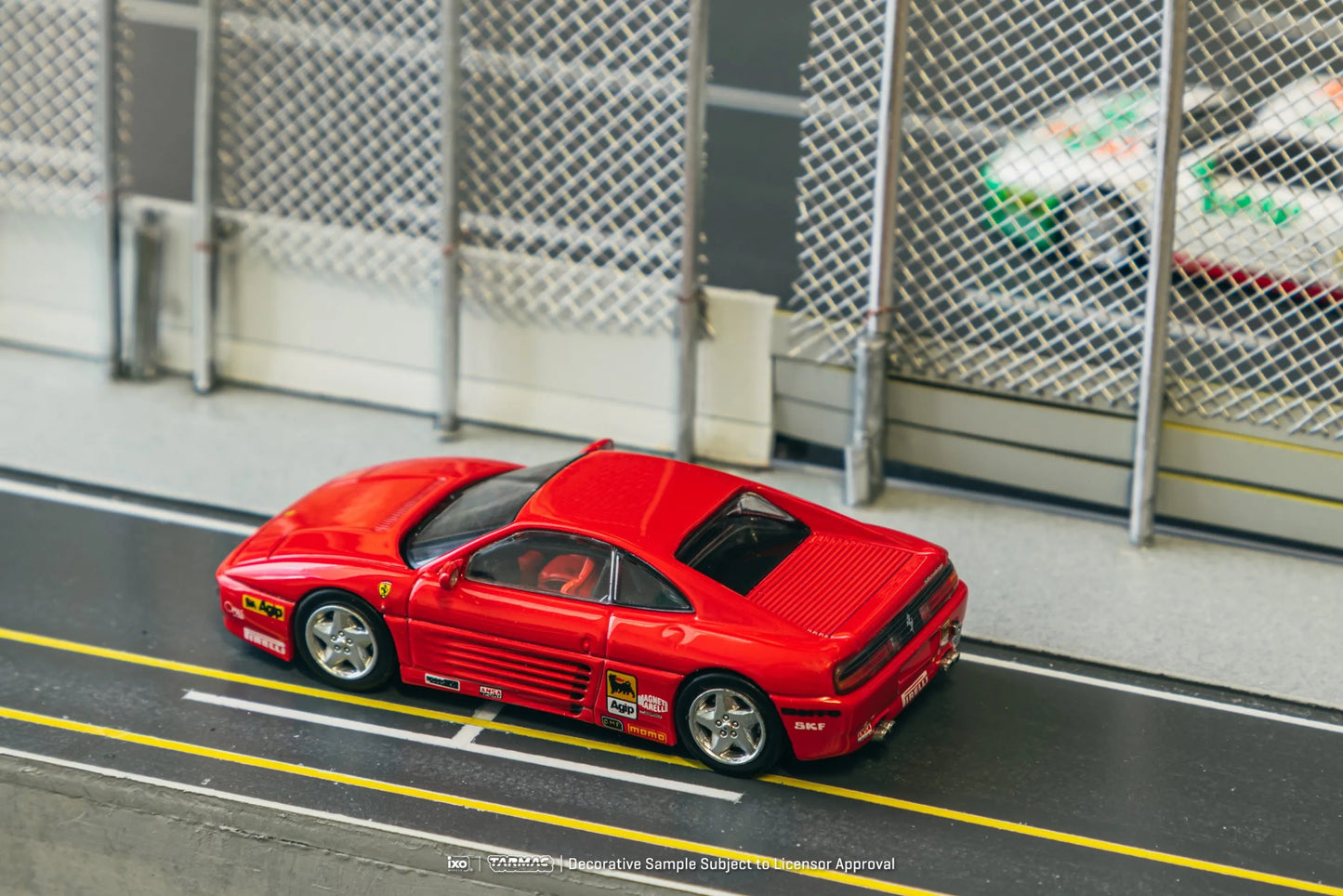 Ferrari 348 Challenge Presentation model car in a racetrack diorama scene