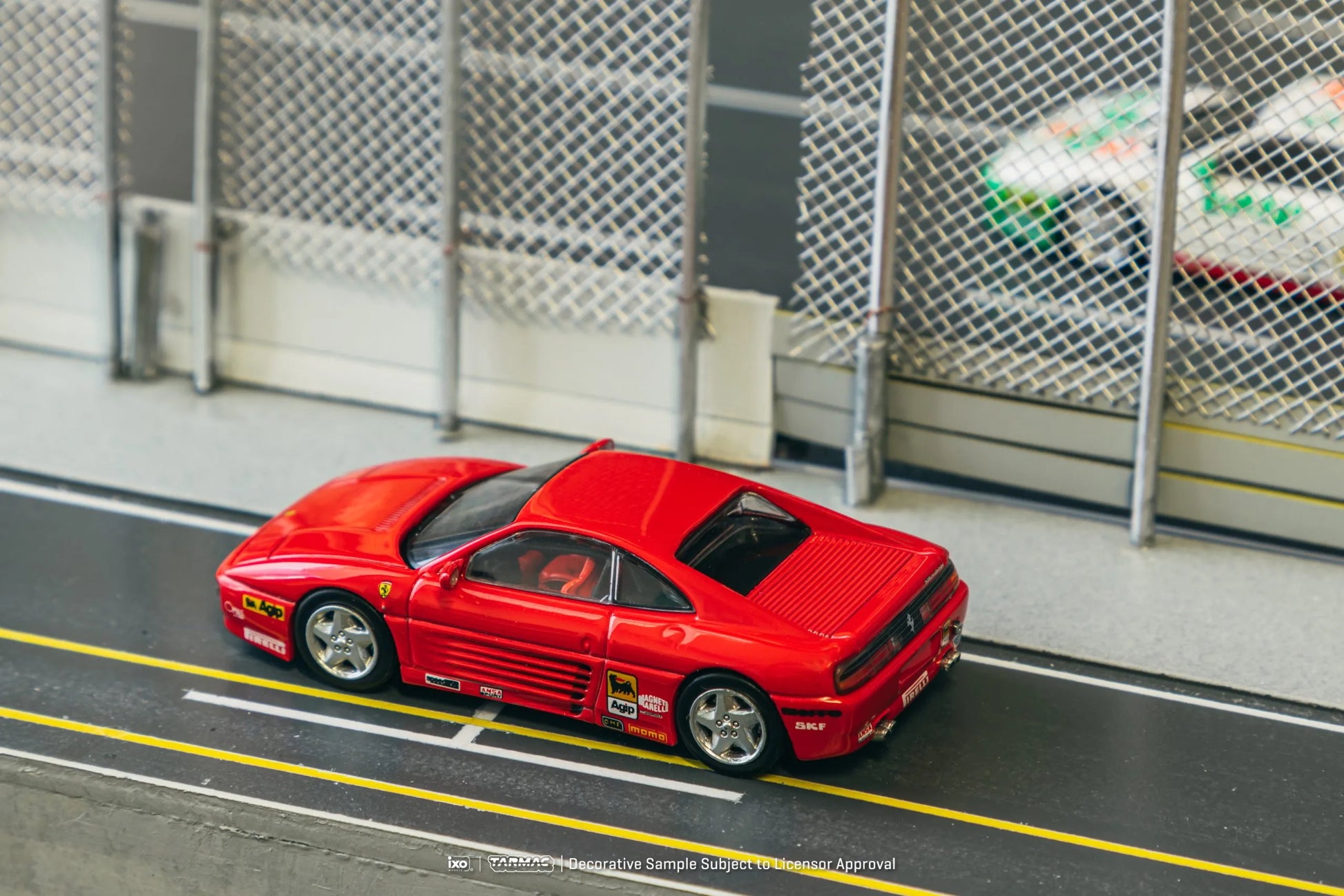 Ferrari 348 Challenge Presentation model car in a racetrack diorama scene