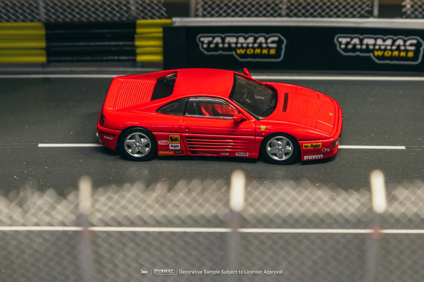 Ferrari 348 Challenge Presentation model car in a racetrack diorama scene
