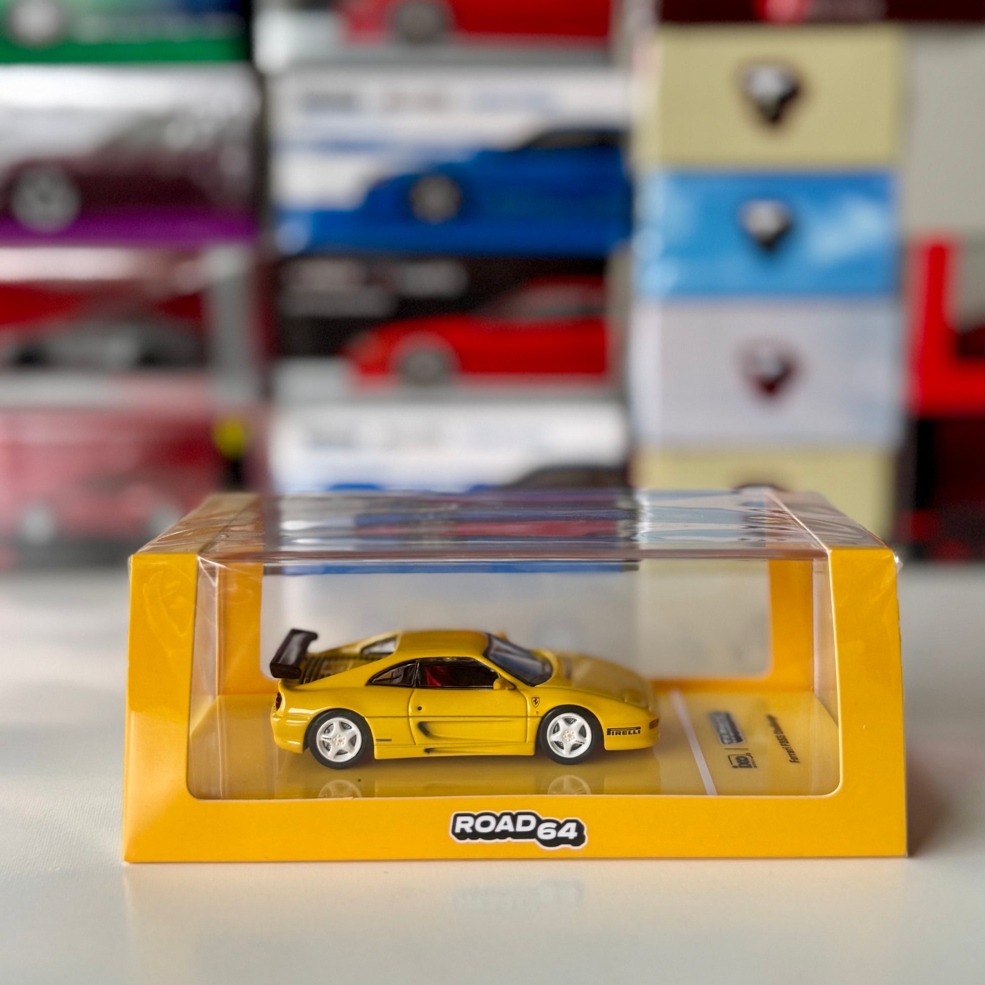 Ferrari F355 Challenge Yellow diecast model in original Road64 box – front view