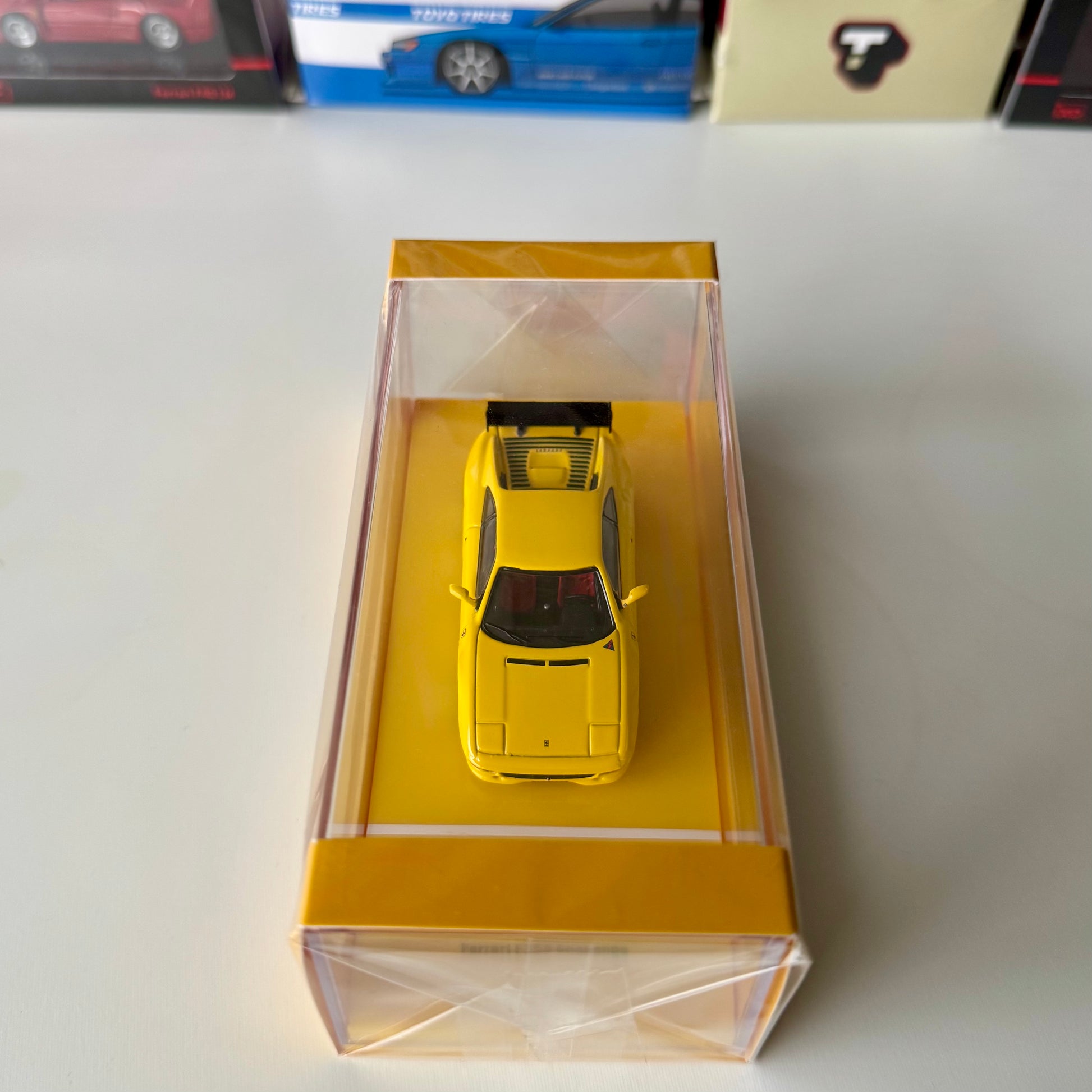 Top view of Ferrari F355 Challenge Yellow diecast car in box