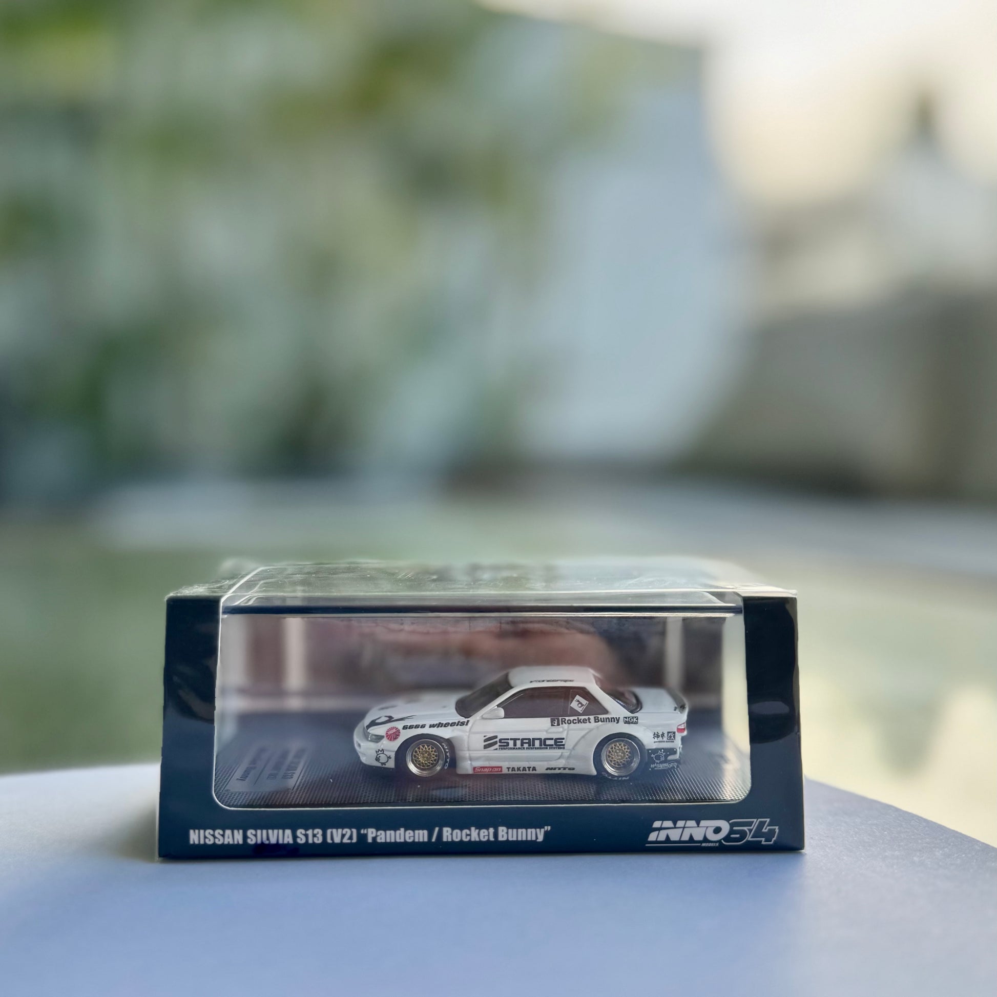 Front view of INNO64 Nissan Silvia S13 Pandem V2 White – 1:64 scale diecast model panorama
