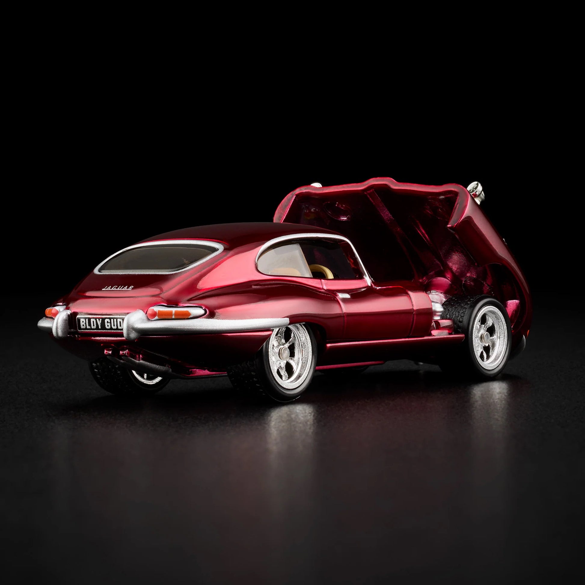 Loose 1964 Jaguar E-Type model with hood open showing detailed engine