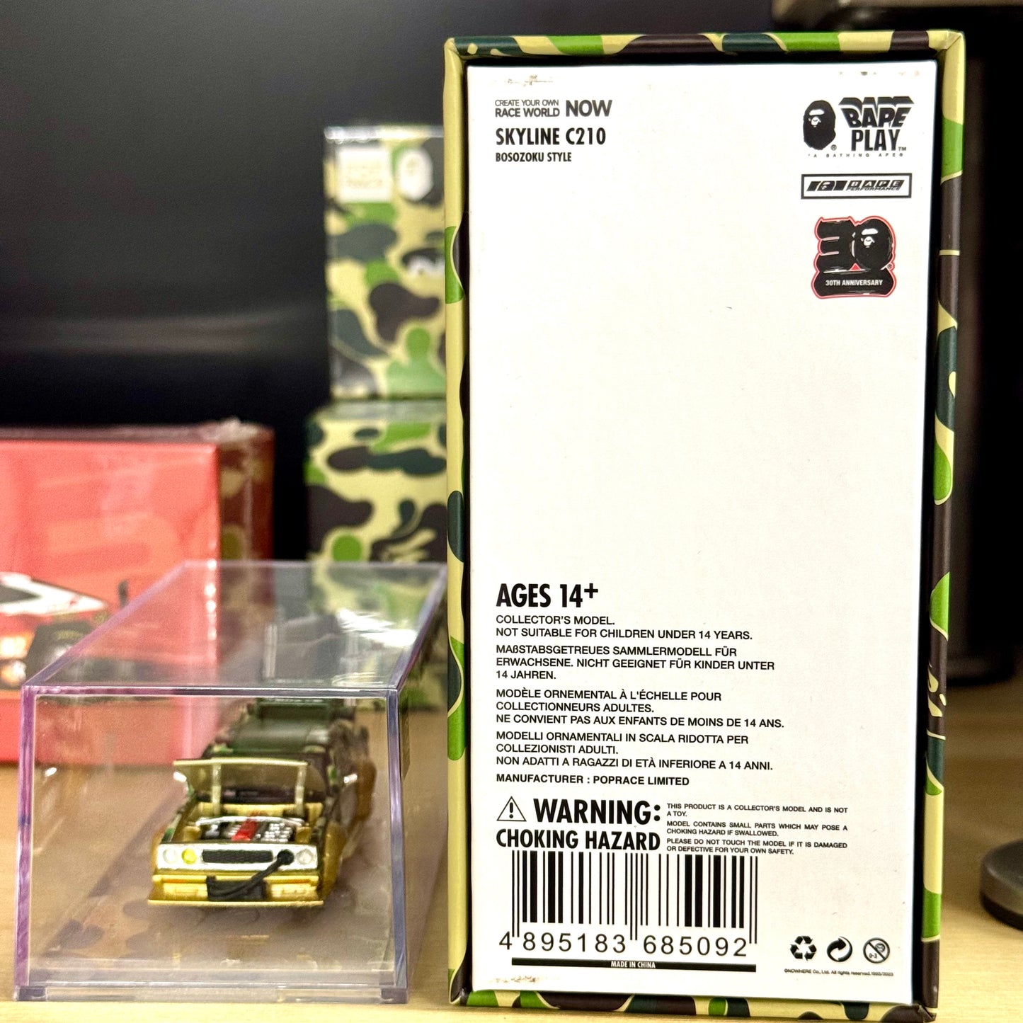 Rear view of official Pop Race packaging for BAPE Nissan Skyline C210 diecast