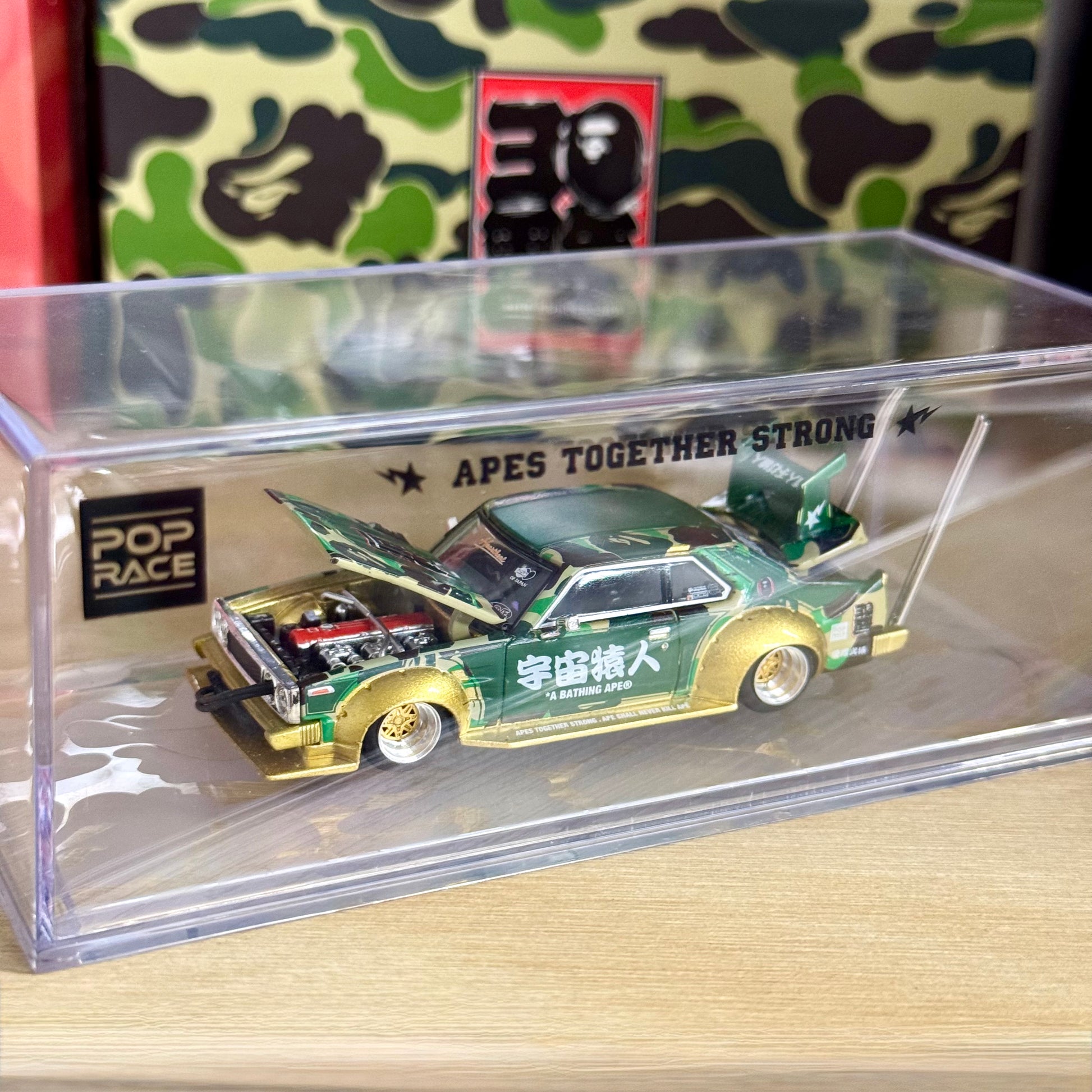 Top-down view of BAPE edition Nissan Skyline C210 Kaido Racer in packaging case