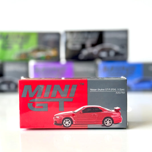 Front of boxed Nissan Skyline GT-R R34 V-Spec Active Red 1:64 diecast by Mini GT