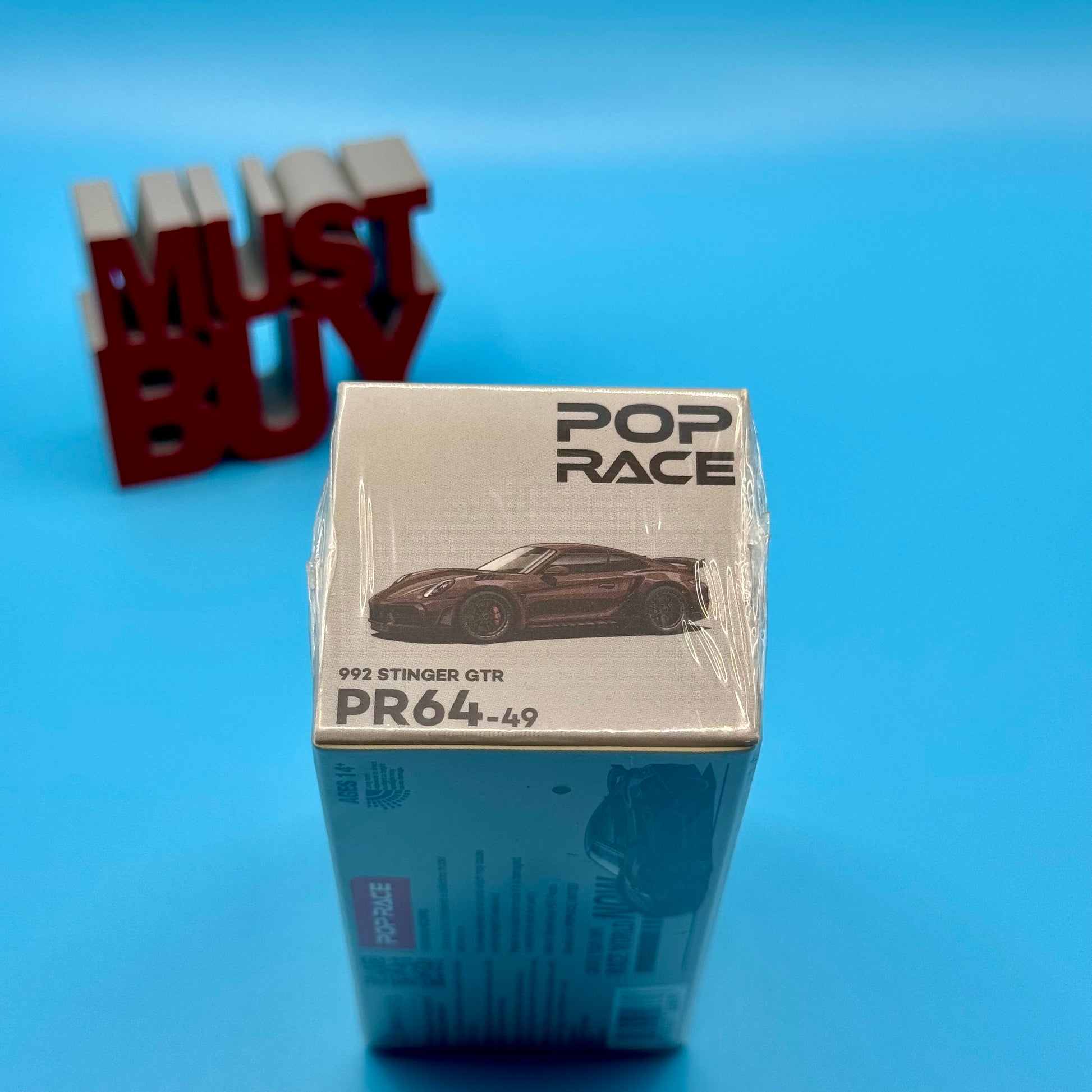 Top view of Pop Race Porsche 992 Stinger GTR Carbon Brown packaging