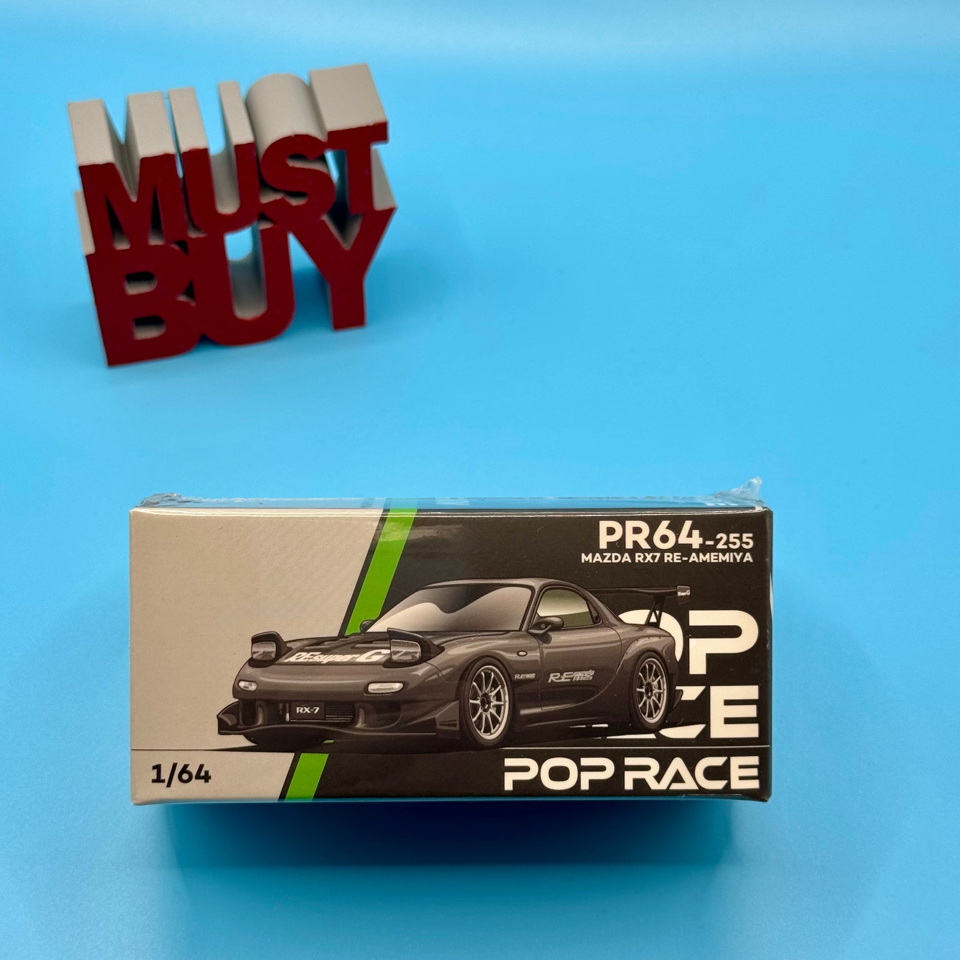 Front view of boxed Pop Race Mazda RX-7 RE-AMEMIYA Widebody model in 1:64 scale