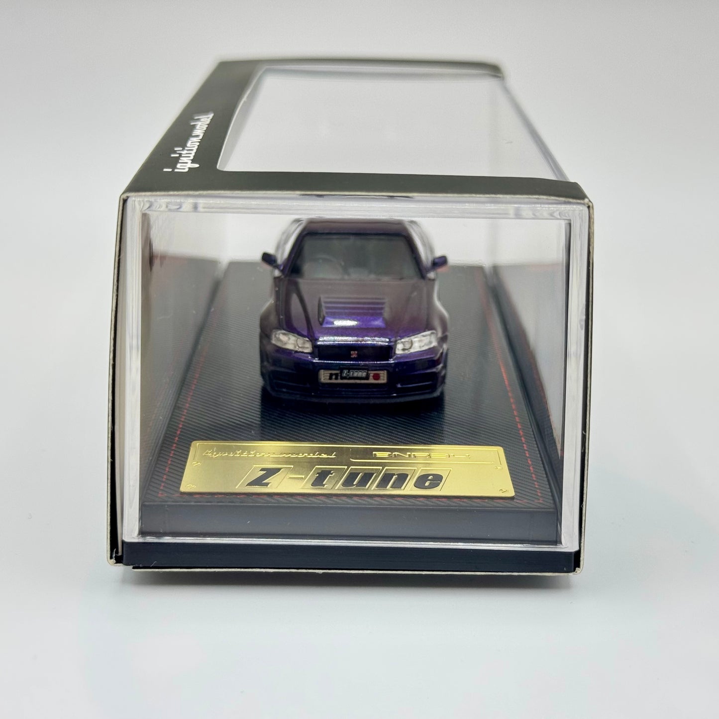 Tarmac Works x Ignition Model Nismo R34 GT-R Z-Tune Midnight Purple III boxed front angle