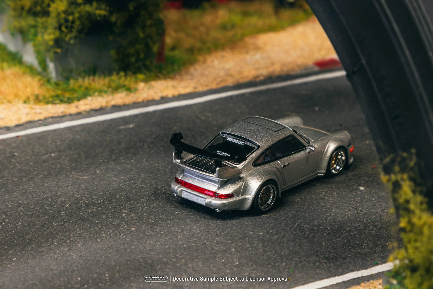 Porsche RWB 964 Silver 1:64 diecast displayed in garage diorama