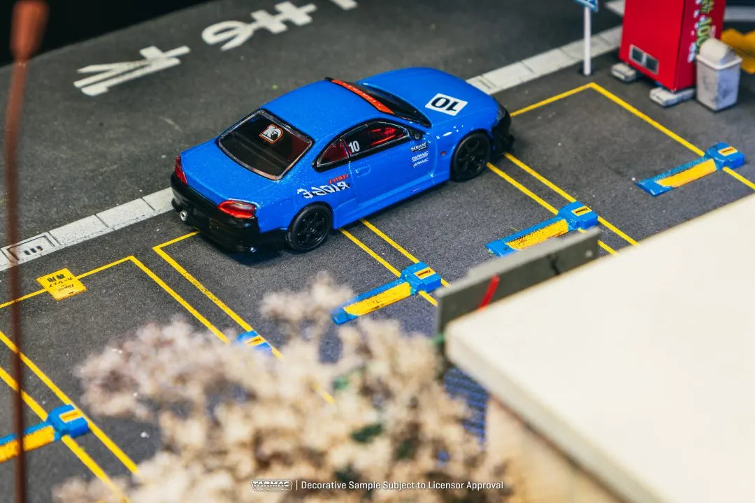 Nissan Silvia S15 Vertex 10th Anniversary 1:64 diecast displayed in parking diorama