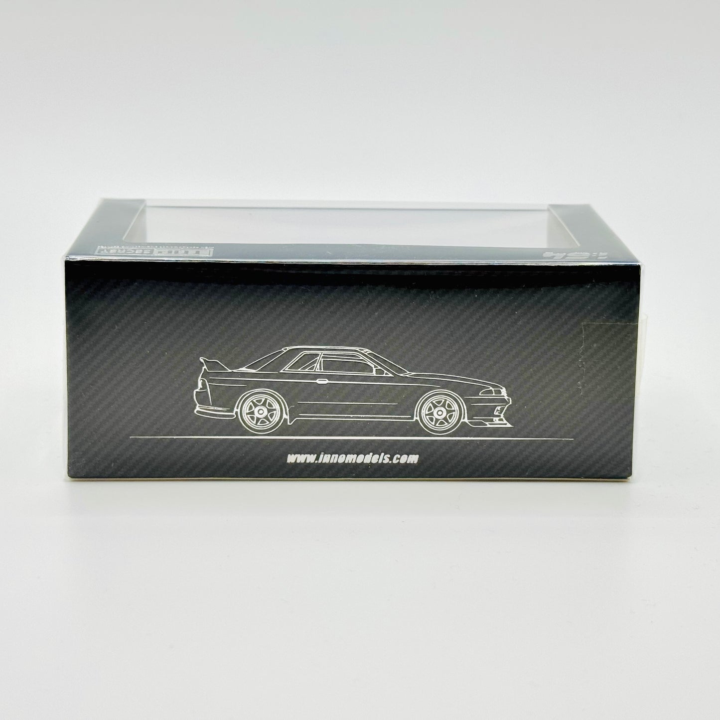 Side view of boxed Inno64 Nissan GT-R R32 Top Secret Stealth Grey