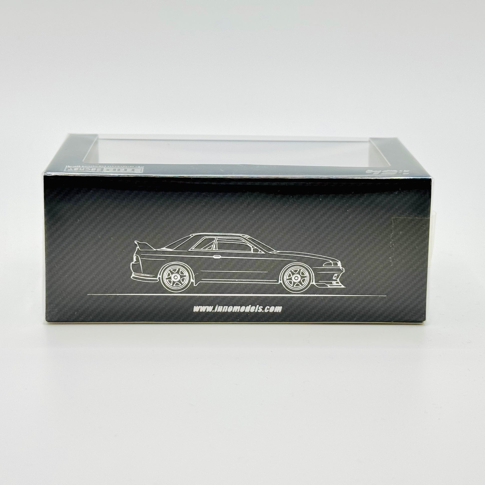 Side view of boxed Inno64 Nissan GT-R R32 Top Secret Stealth Grey