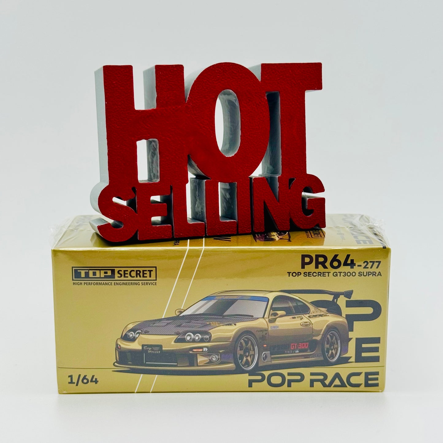 Top Secret Toyota Supra GT300 Pop Race 1:64 diecast model box front view